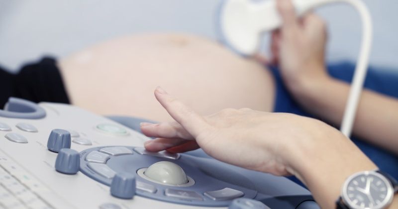 Pregnant girl doing on ultrasound examination