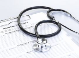 Stethoscope and Medical History Report