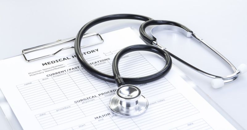 Stethoscope and Medical History Report