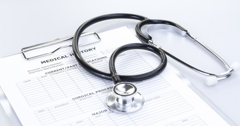 Stethoscope and Medical History Report
