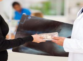 doctor receiving a bribe from medical representative