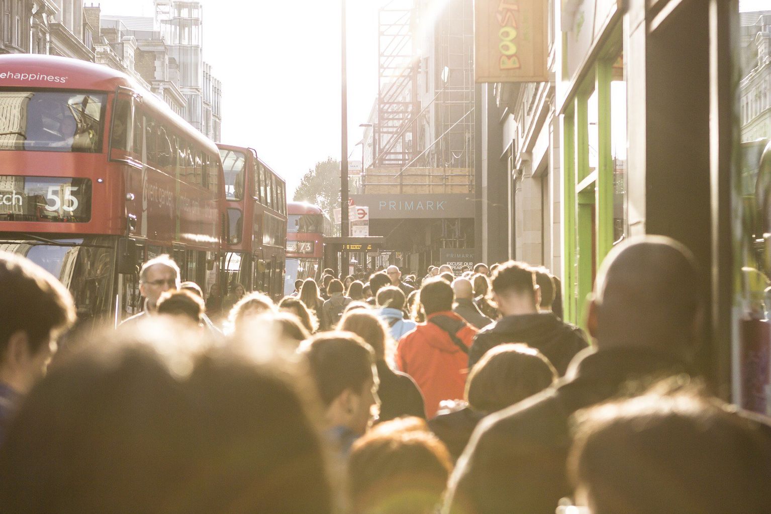 Lots of people on a busy sidewalk in London