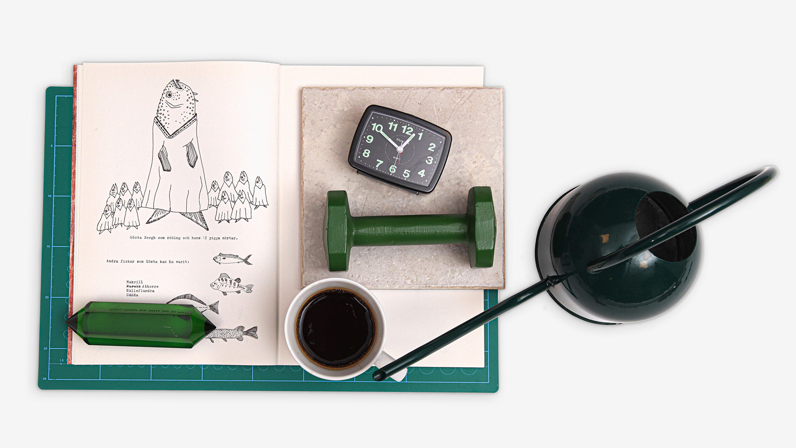 A composition with a green water can, a sketchbook, a cup of coffee, and a clock. The picture represents tools and ideas related to studying at Berghs School of Communication