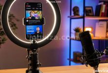 Creator filming with a phone to start a YouTube channel in Nigeria