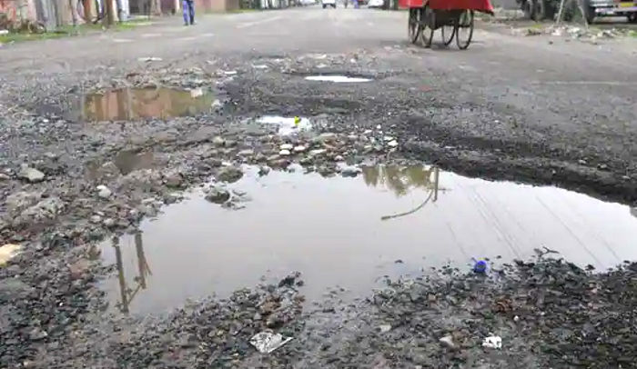 Noida broken roads