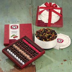 All occasion tower showing open original assortment and triple cherry nut tin