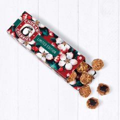 Hazelnut cherries spilling out of cherry blossom pattern box