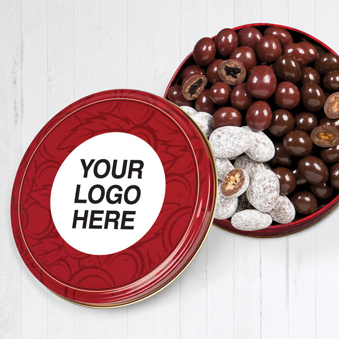 Lid of cherries and pecan tin has customizable logo applied and tin is open so product is visible