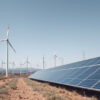 Clean energy in harmony Wind turbines and solar panels work together to create a stable and sustainable future