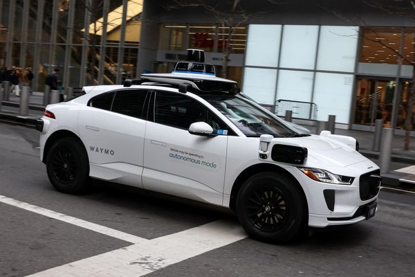 Waymo crosses 450,000 weekly paid rides as Alphabet robotaxi unit widens lead on Tesla
