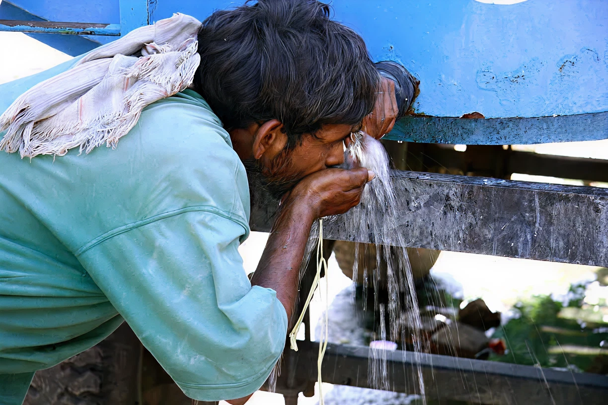 Workers accessing shared water