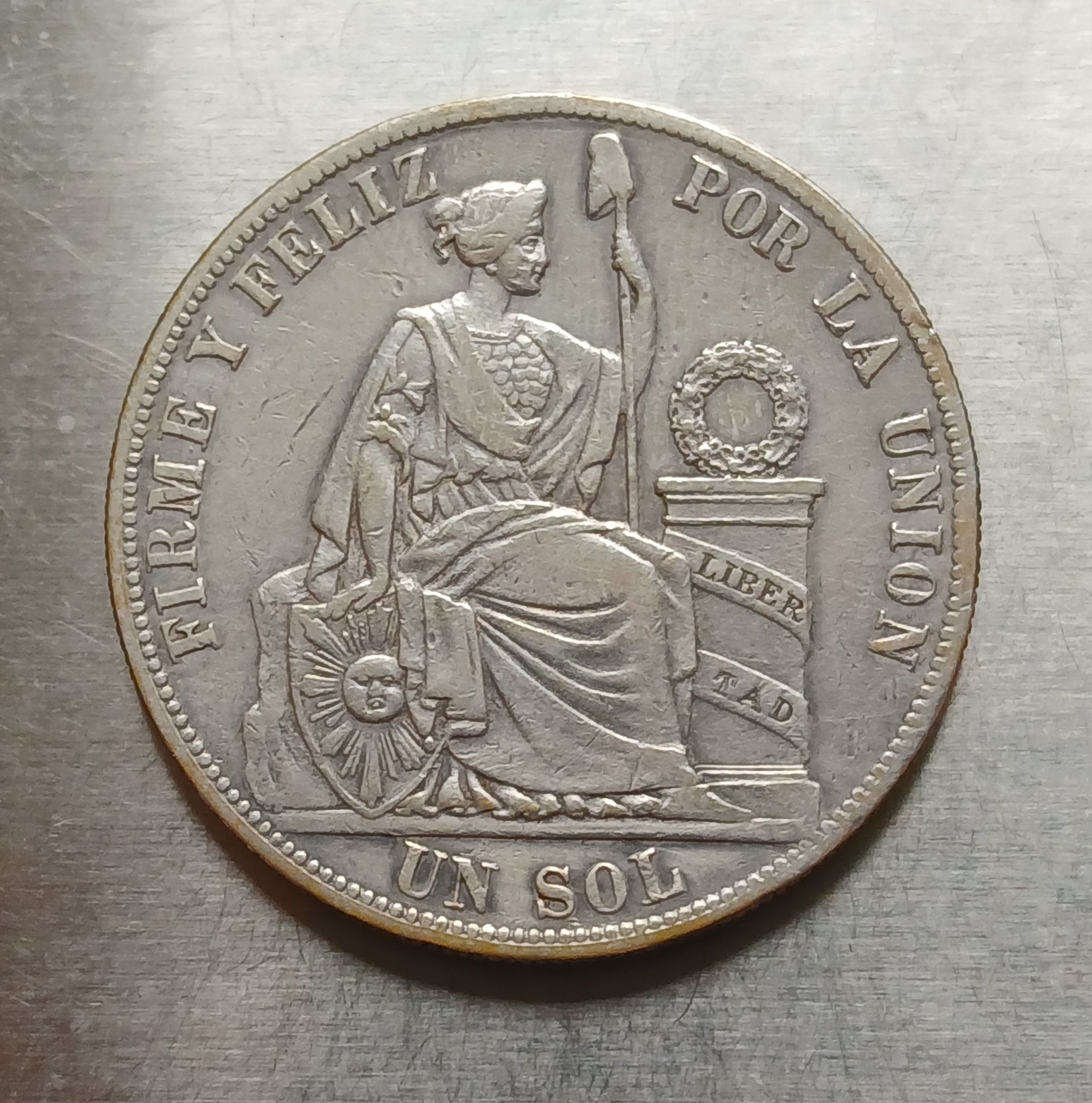 Sol 1885 ensayador R.D. plata 9 décimos