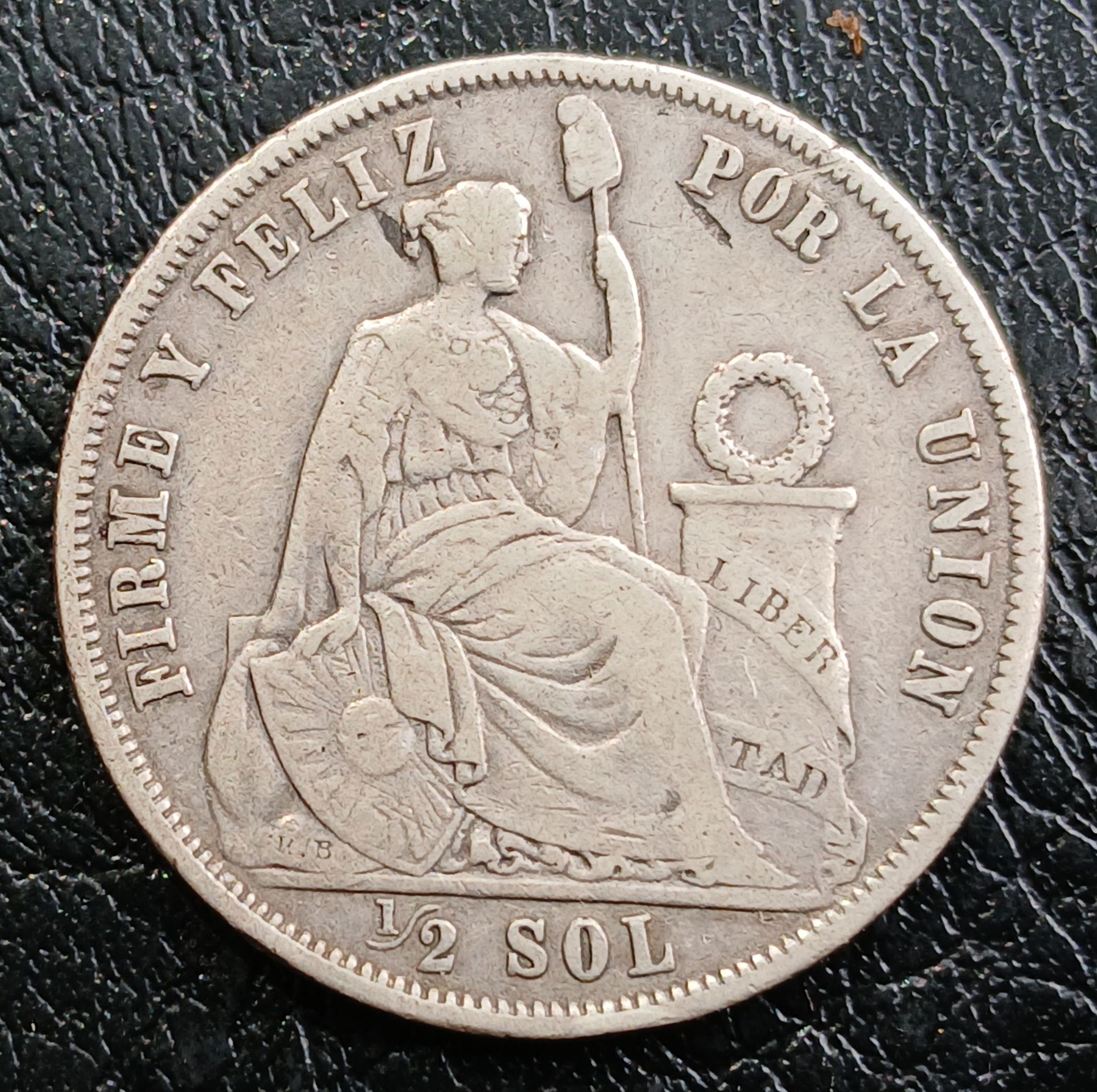 Medio sol 1864 revirada plata 9 décimos