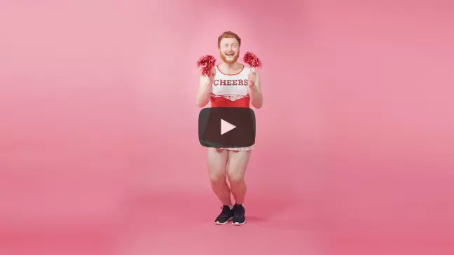 Preview of the Collctiv video, with a still image of a man in a cheerleading outfit