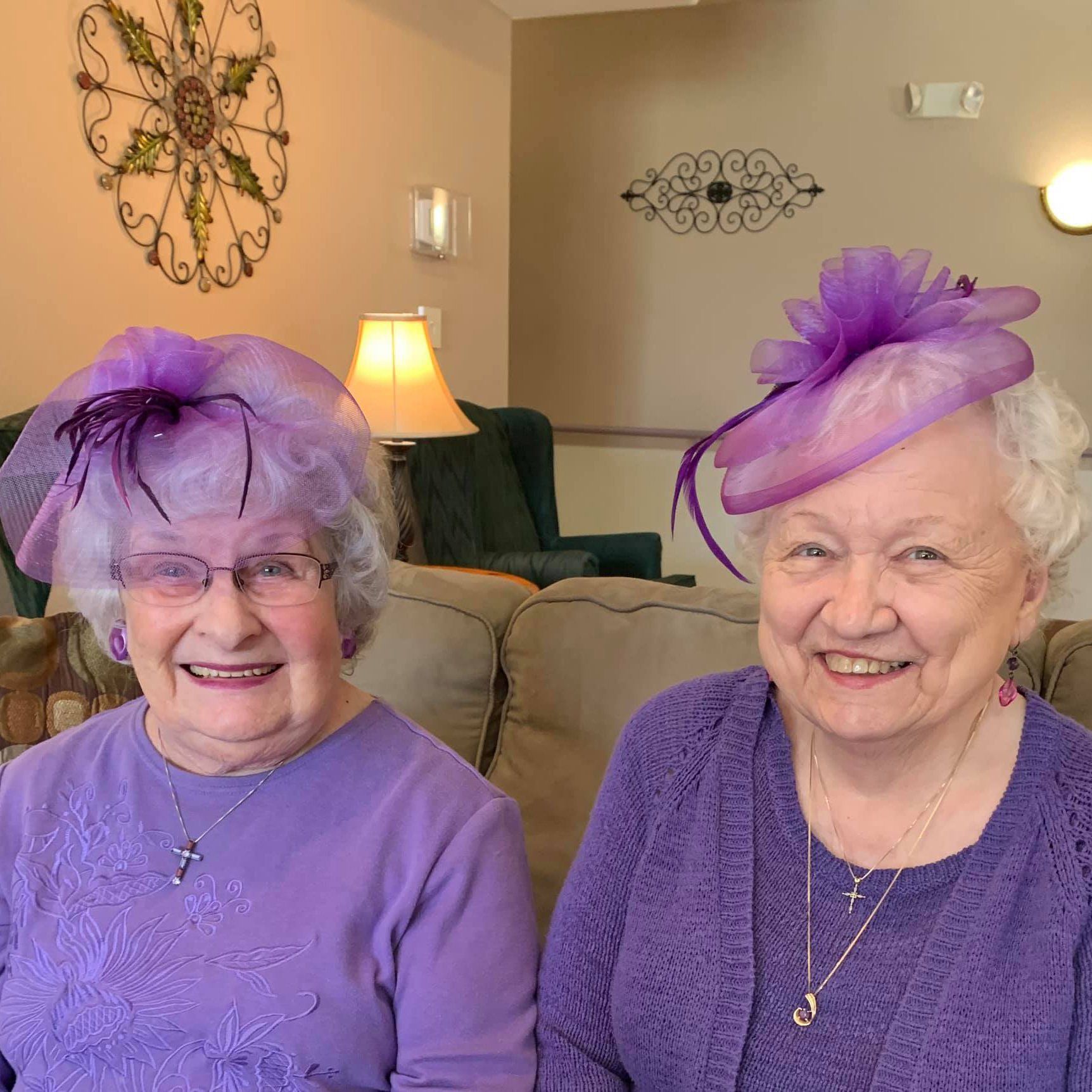 resident-photo-07 Two beautiful women in purple hats at Colonial Inn Olympia