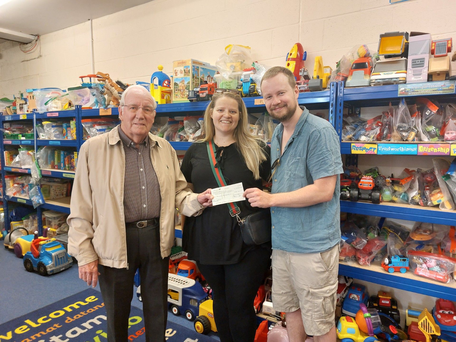 Our chairman Richard Maunder with Marcel and Jess Mulders holding a donation cheque