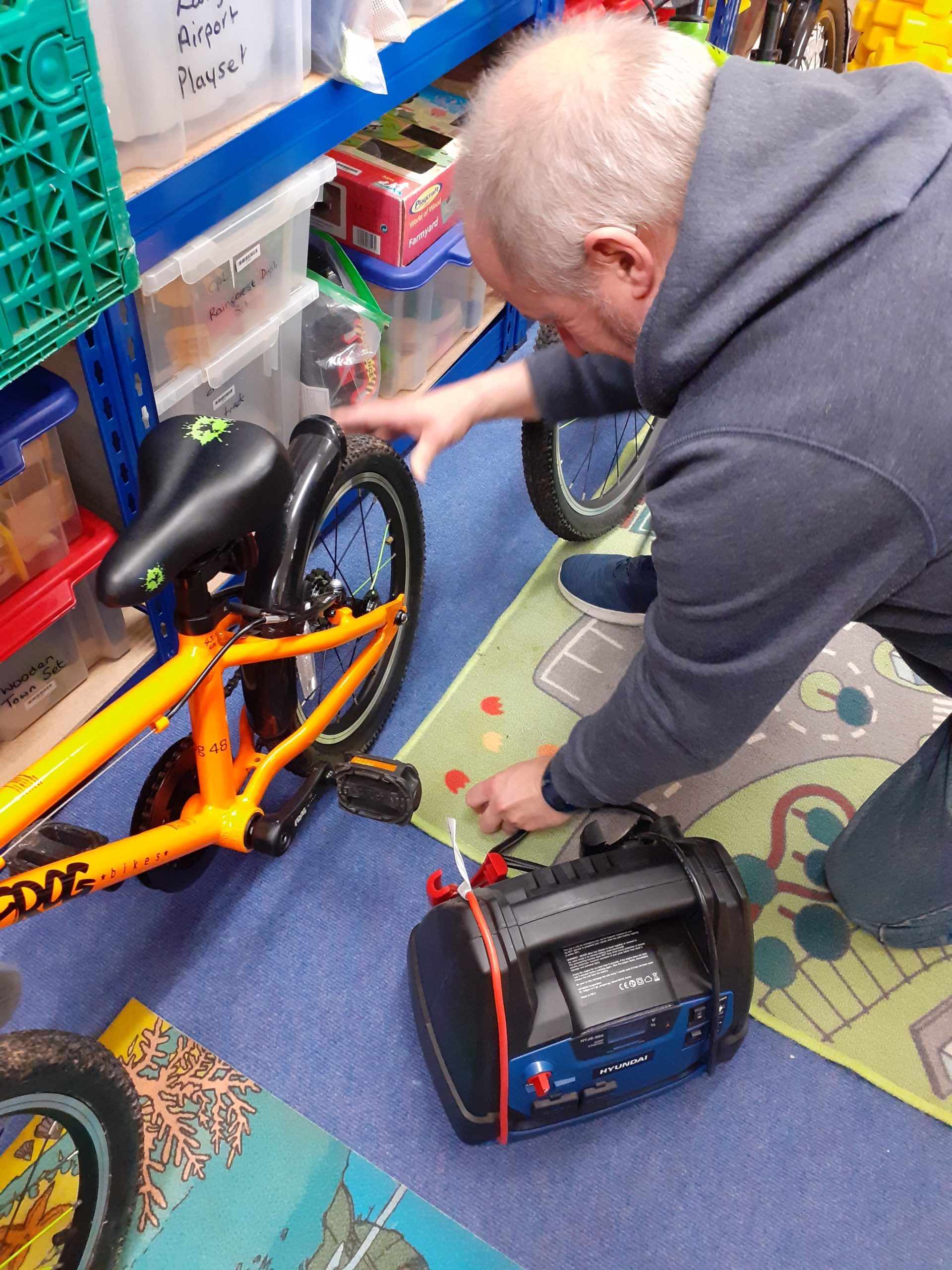 A volunteer helping out at Community Playlink