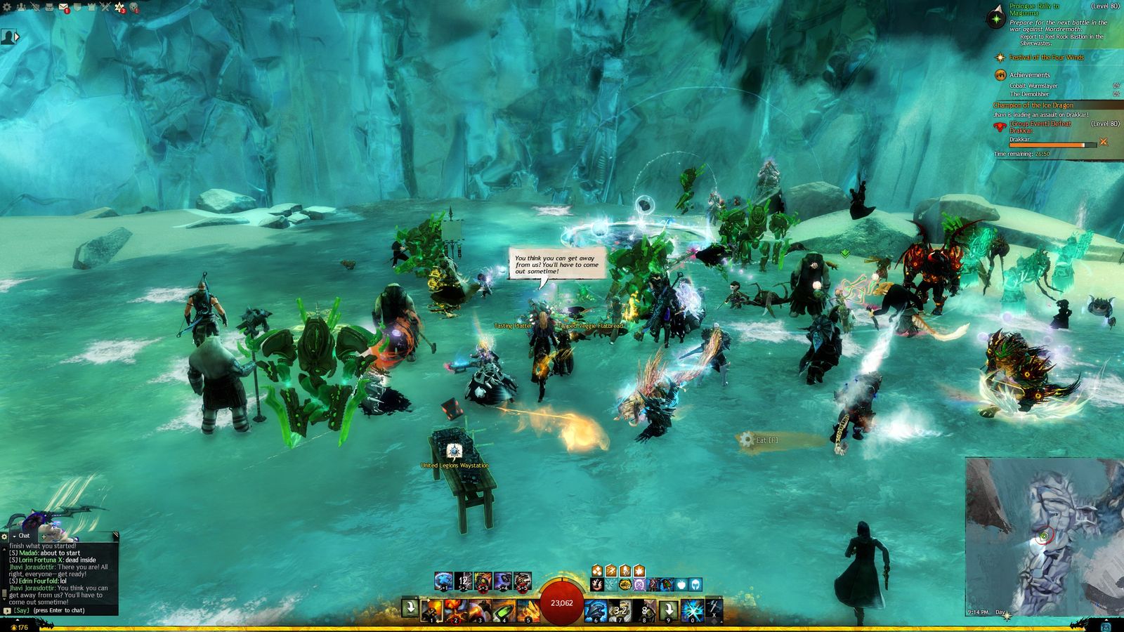 Dozens of Guild Wars 2 players fighting together in shallow water during an open-world event