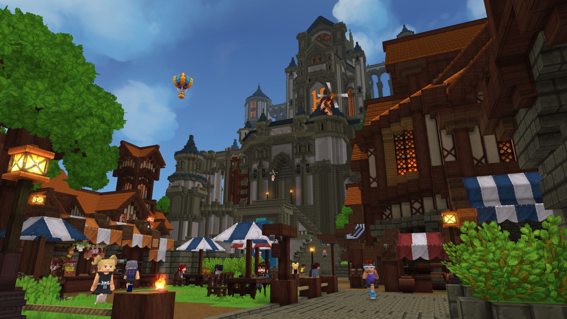 A busy Hytale market town: timber stalls, awnings, a castle behind, a hot air balloon overhead