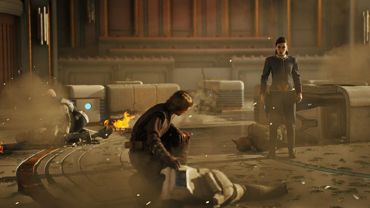 An operator kneeling over a downed squadmate amid fire and dust while another stands guard, in Star Wars Zero Company