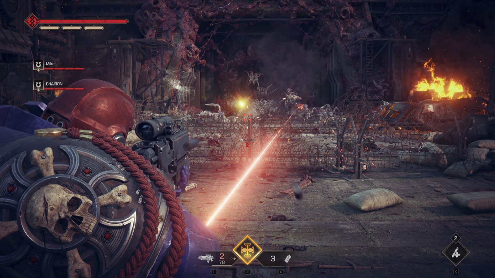 A Space Marine firing a beam weapon from behind cover into a burning gothic ruin