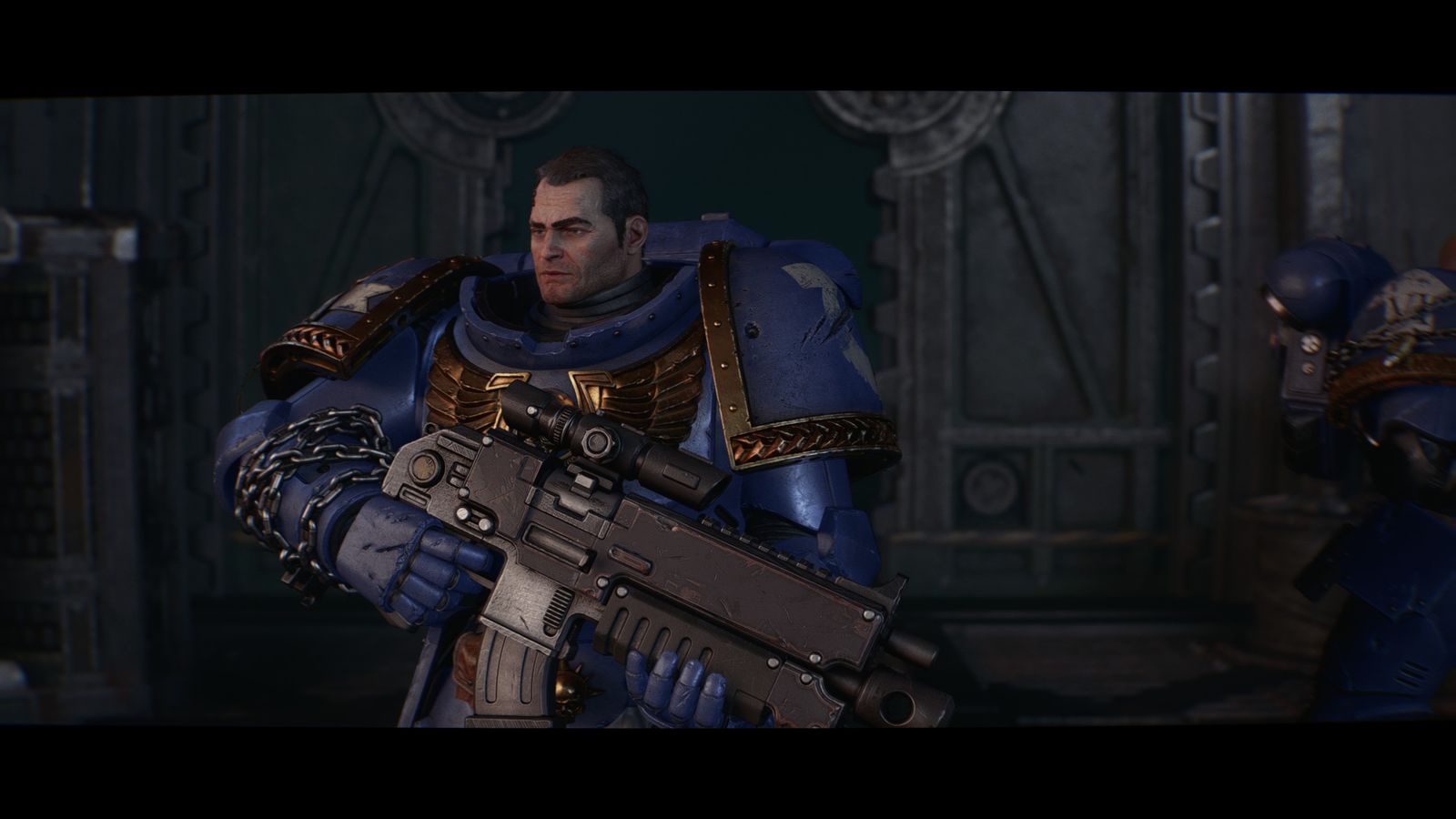 Lieutenant Titus in Ultramarines armour holding a bolt rifle during a cutscene