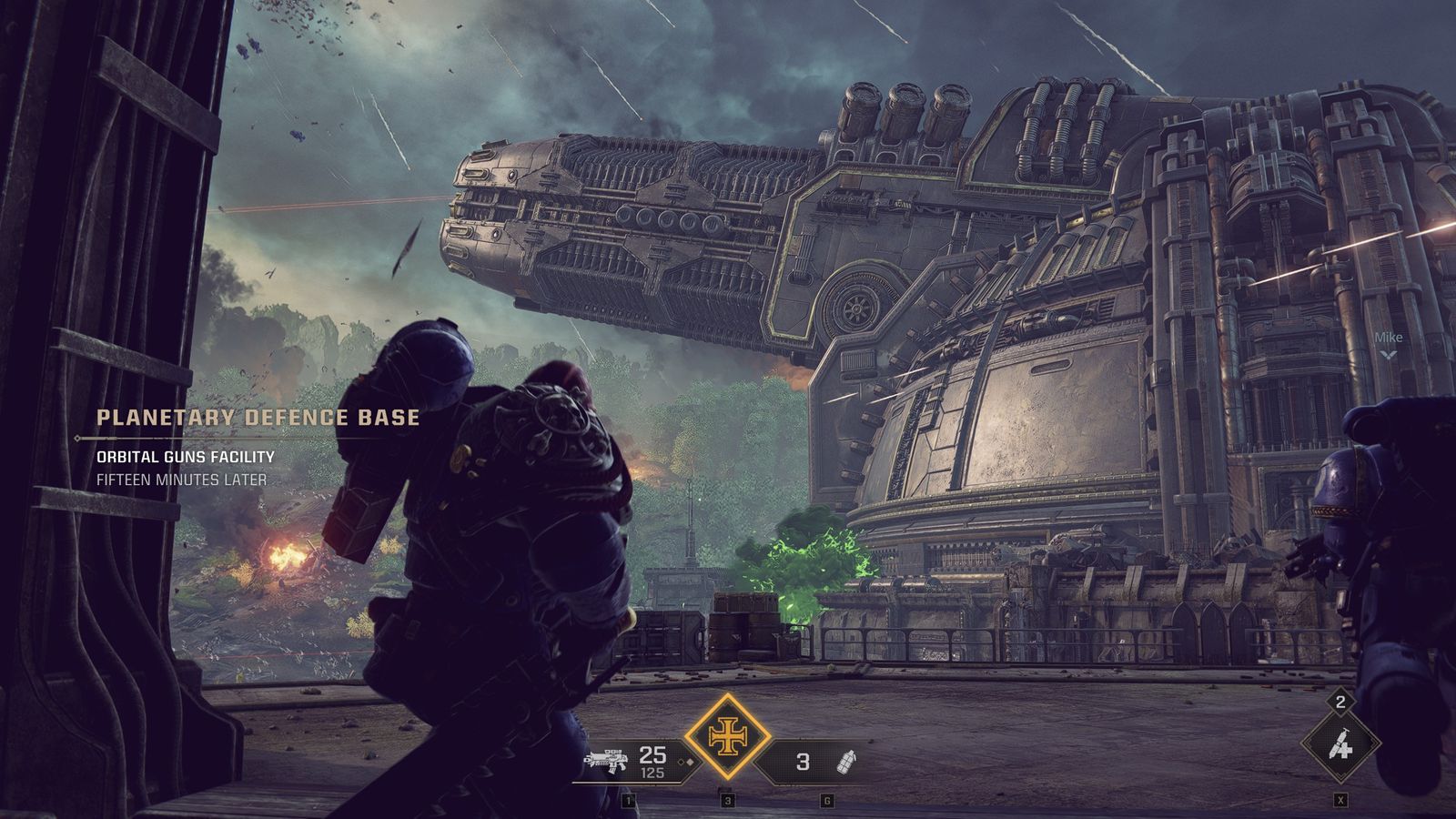 A Space Marine looking out at the orbital guns facility, with the location title card on screen