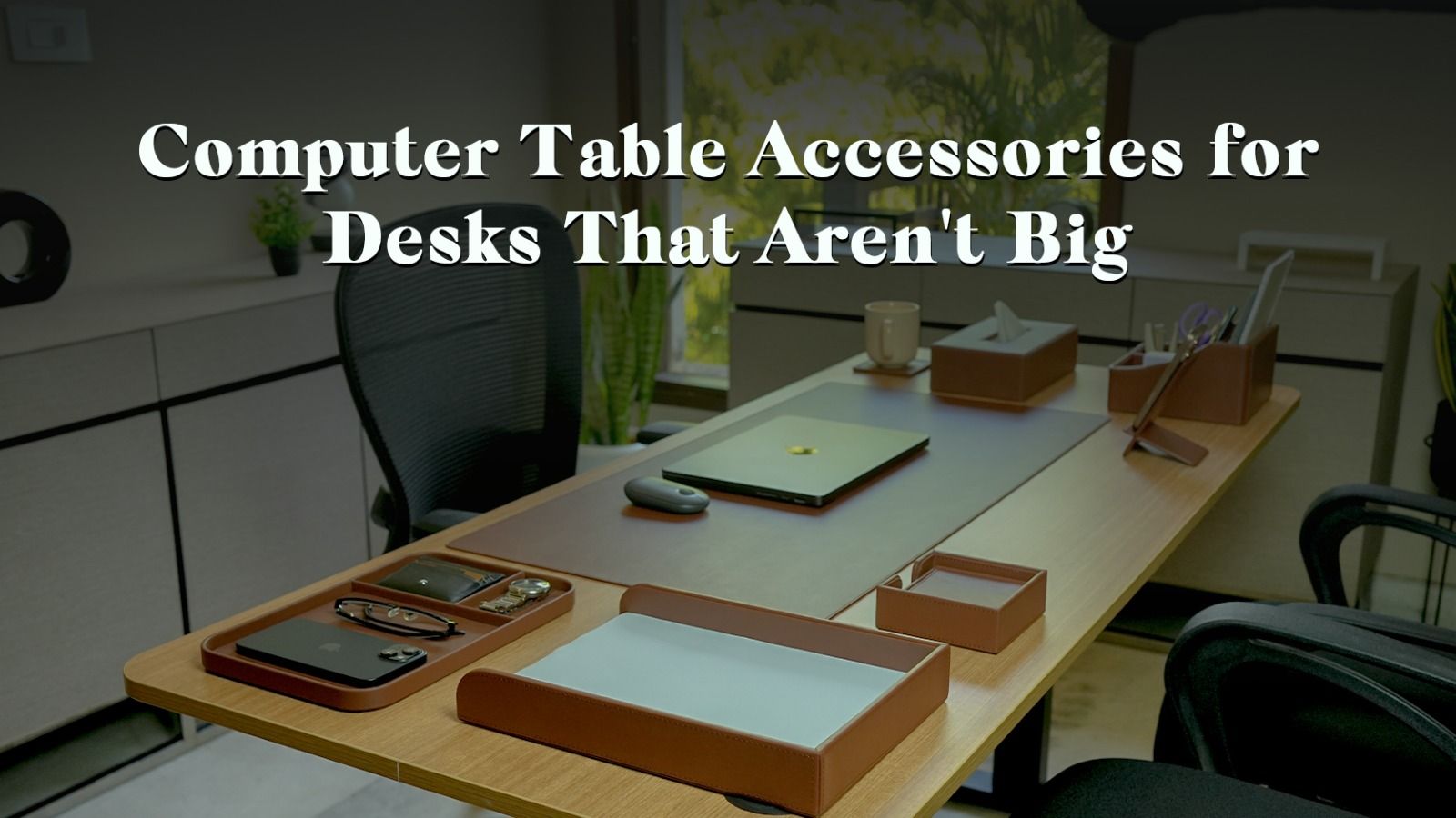 Compact computer table accessories arranged on a small home office desk to maximize limited surface space.
