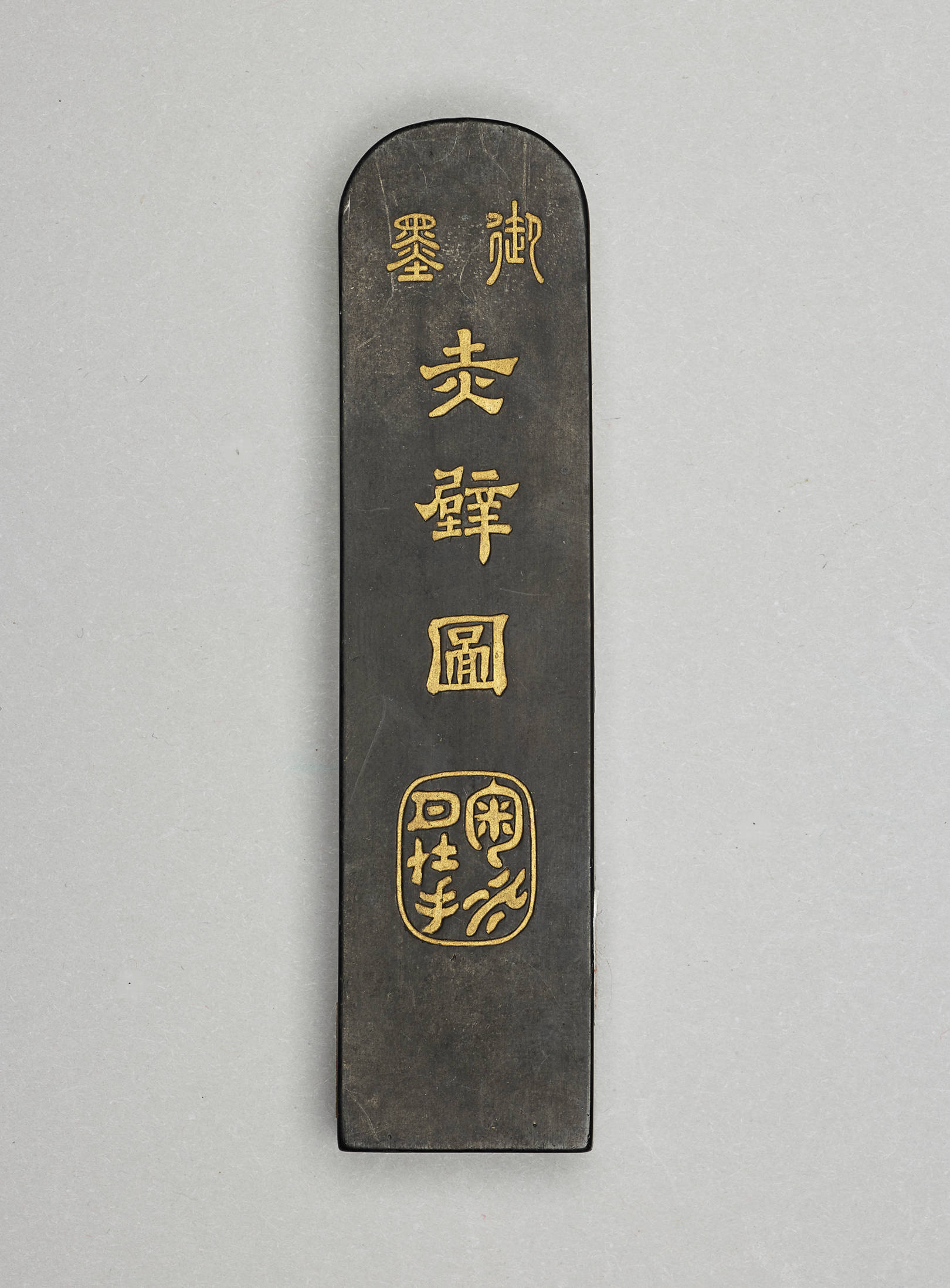 Photograph showing ink stick detail and various gradations of ink wash