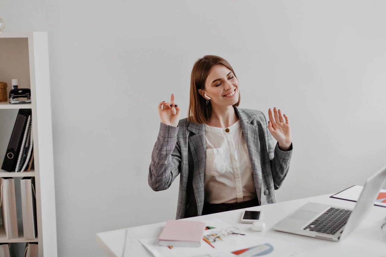 woman coworking and smiling - on Tally Workspace