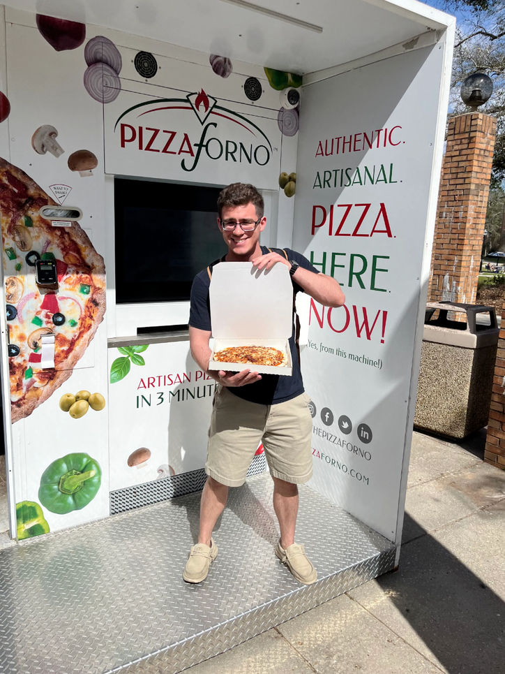 A Pizzaforno ambassador showcasing his order.