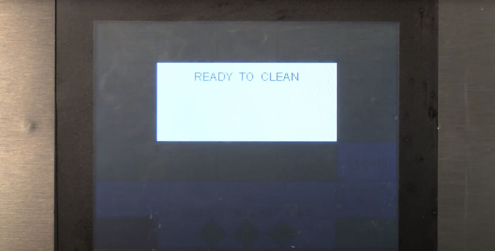 Taylor grill control reading “Ready to Clean,” indicating safe cleaning temperature.