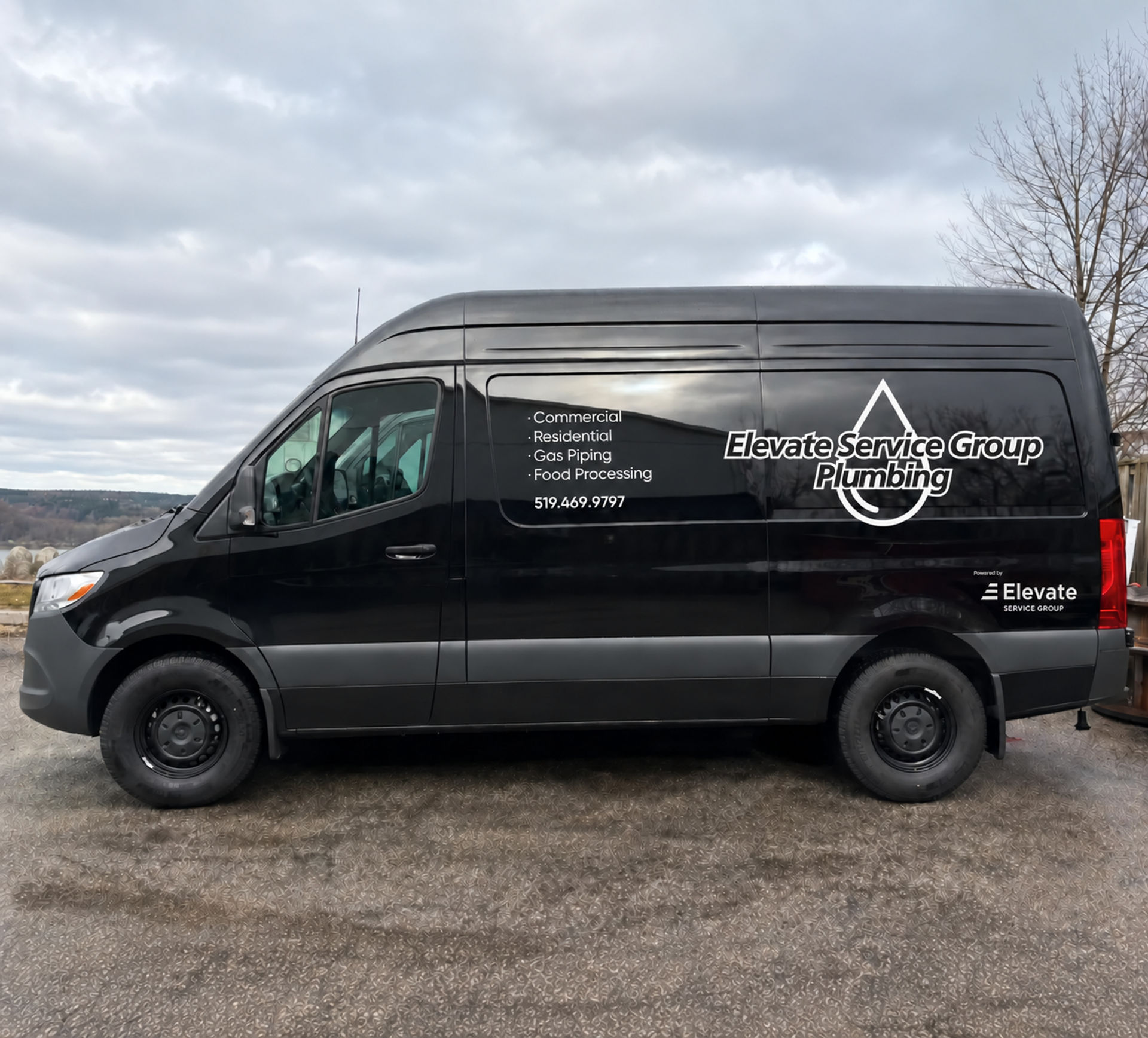 Elevate Service Group Plumbing branded van parked outdoors