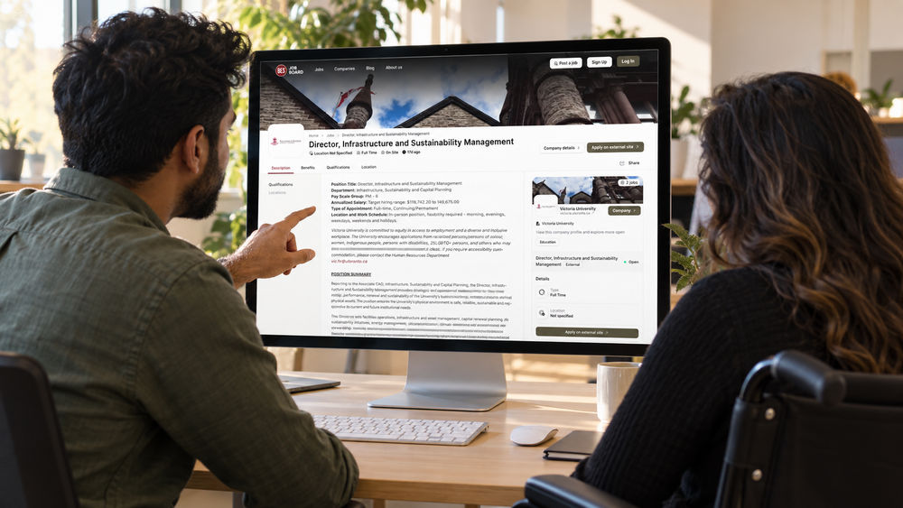 Hiring manager and a colleague in a wheelchair reviewing a job posting with an equity statement and an accommodation contact