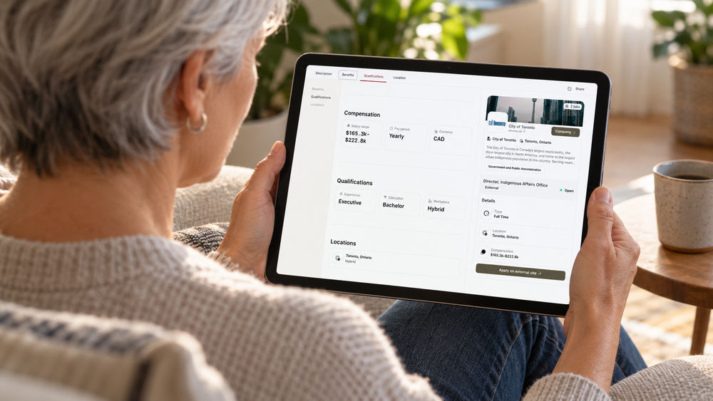 Senior executive reviewing the compensation range and qualifications of a BES Job Board posting on a tablet