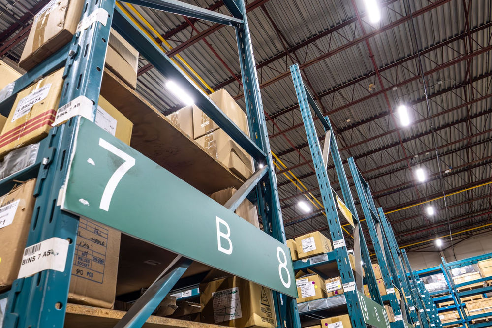LED high bay lighting over racking in an Ontario warehouse after a commercial LED retrofit