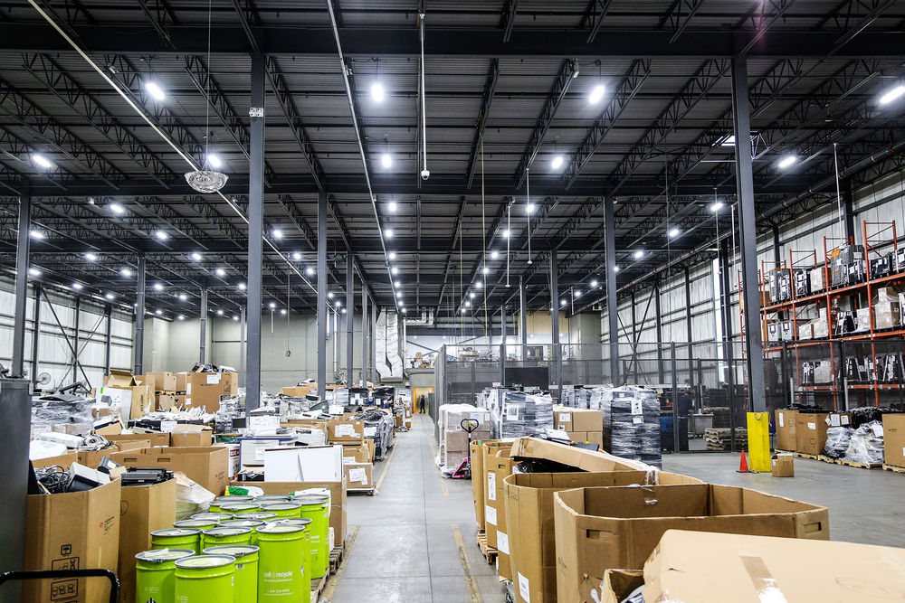 LED high bay lighting in a Canadian logistics warehouse with pallet racking and a central aisle