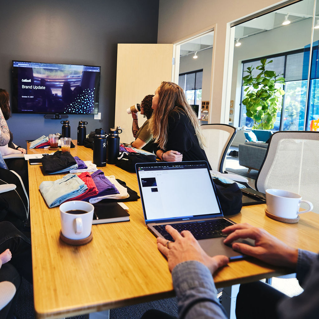 The team gathers for a project brief on a new Django application.