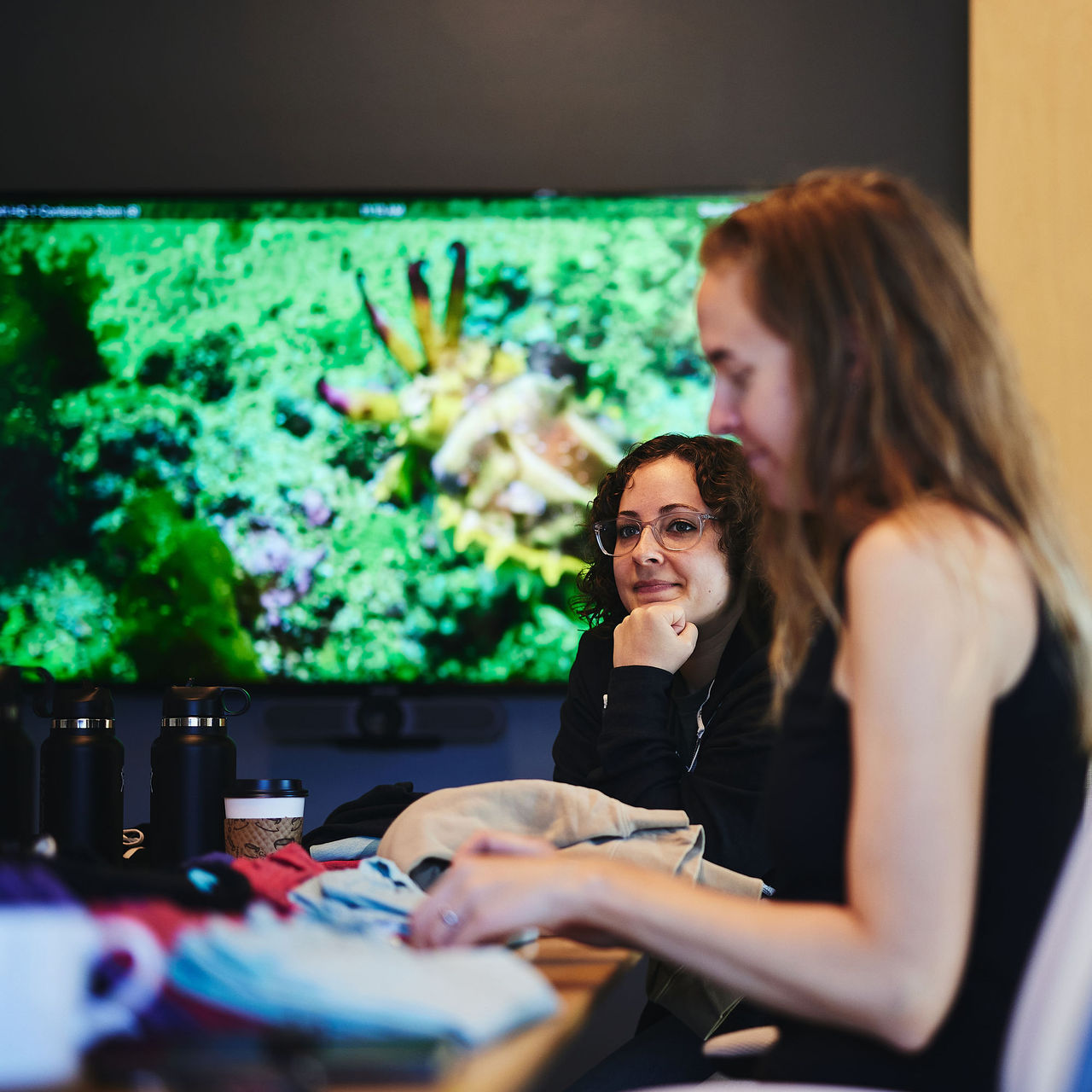 Marisa listens on as the team presents on a new project brief for a client's Rails application.