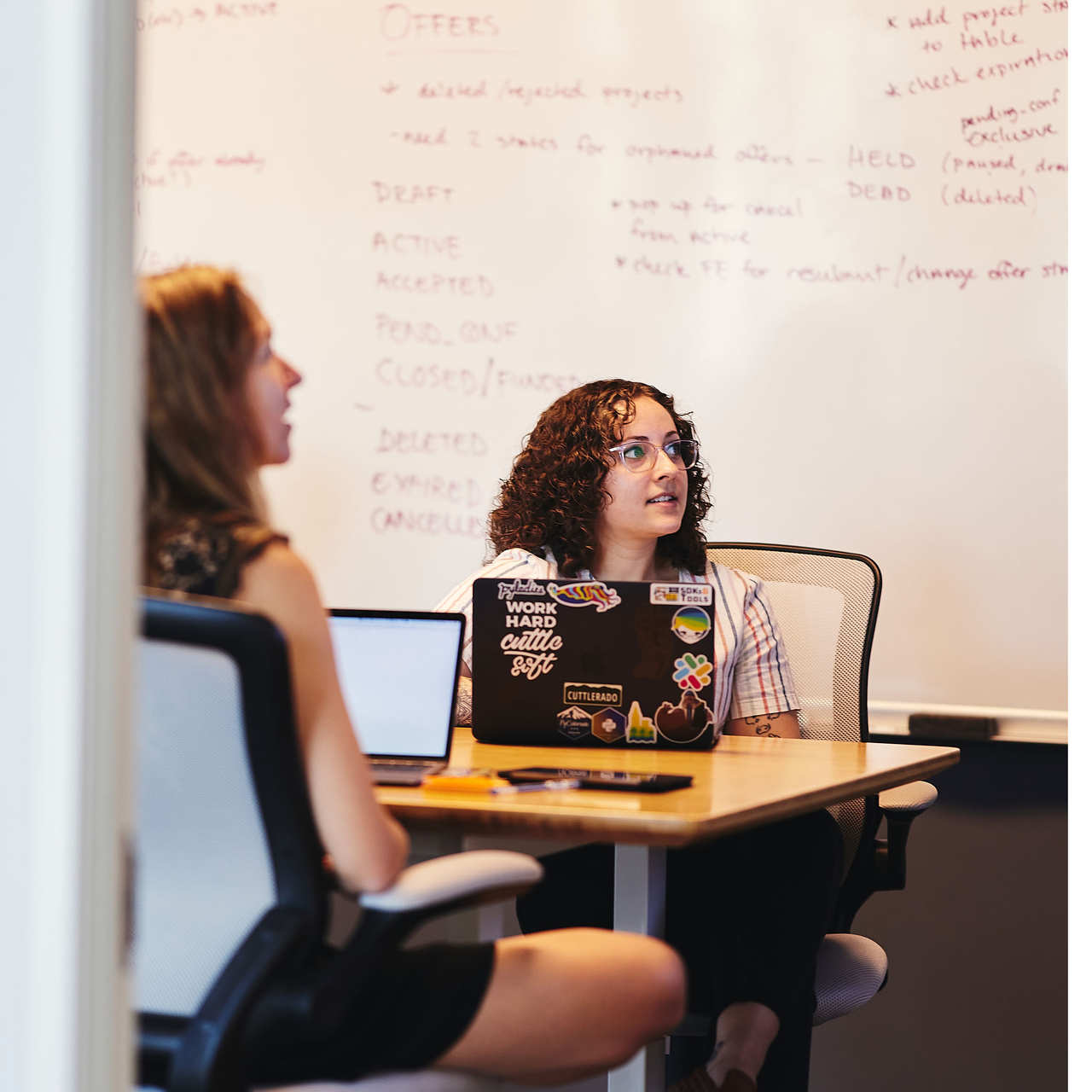 Marisa and Sara go over a sprint plan for a project involving Ruby Sidekiq.