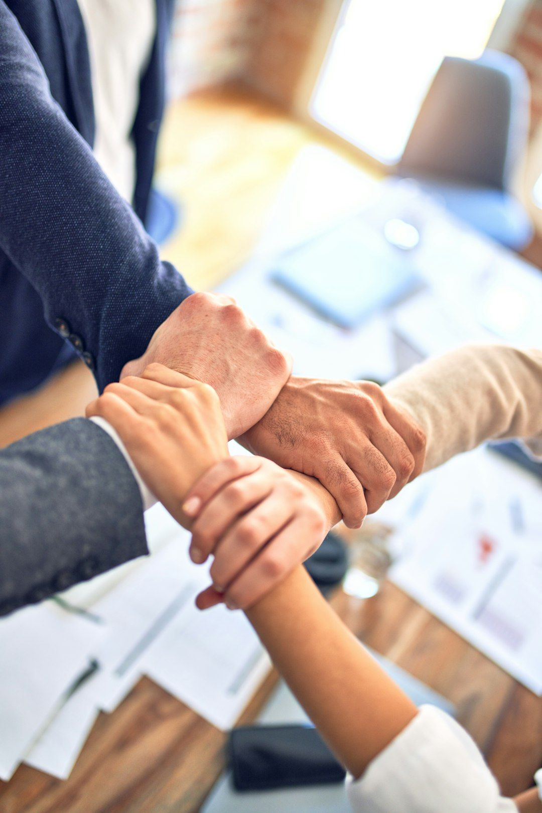 Diverse professionals collaborating around conference table in modern