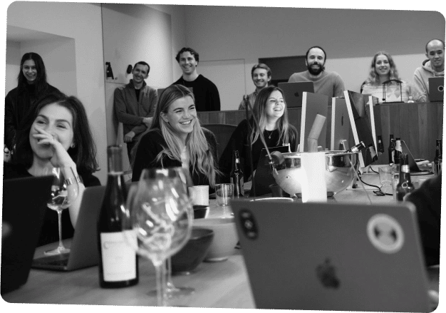 Employees in meeting discussing charts on