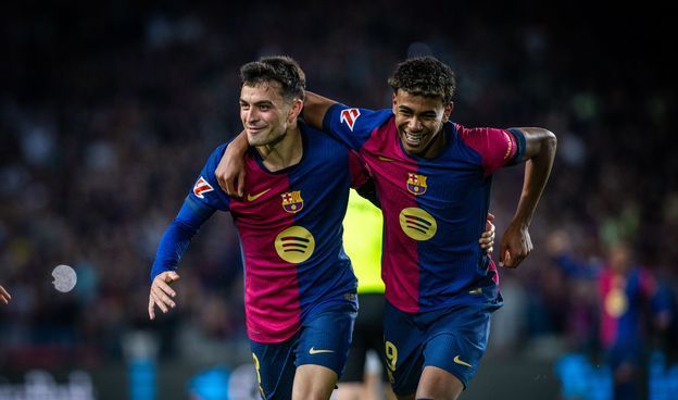 Fc barcelona players in action during a competitive football match