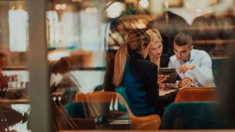 Lawyer reviewing documents on a laptop in an office
