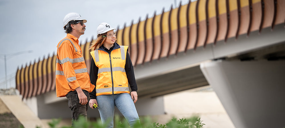 Modern office workspace with multiple monitors displaying cloud service