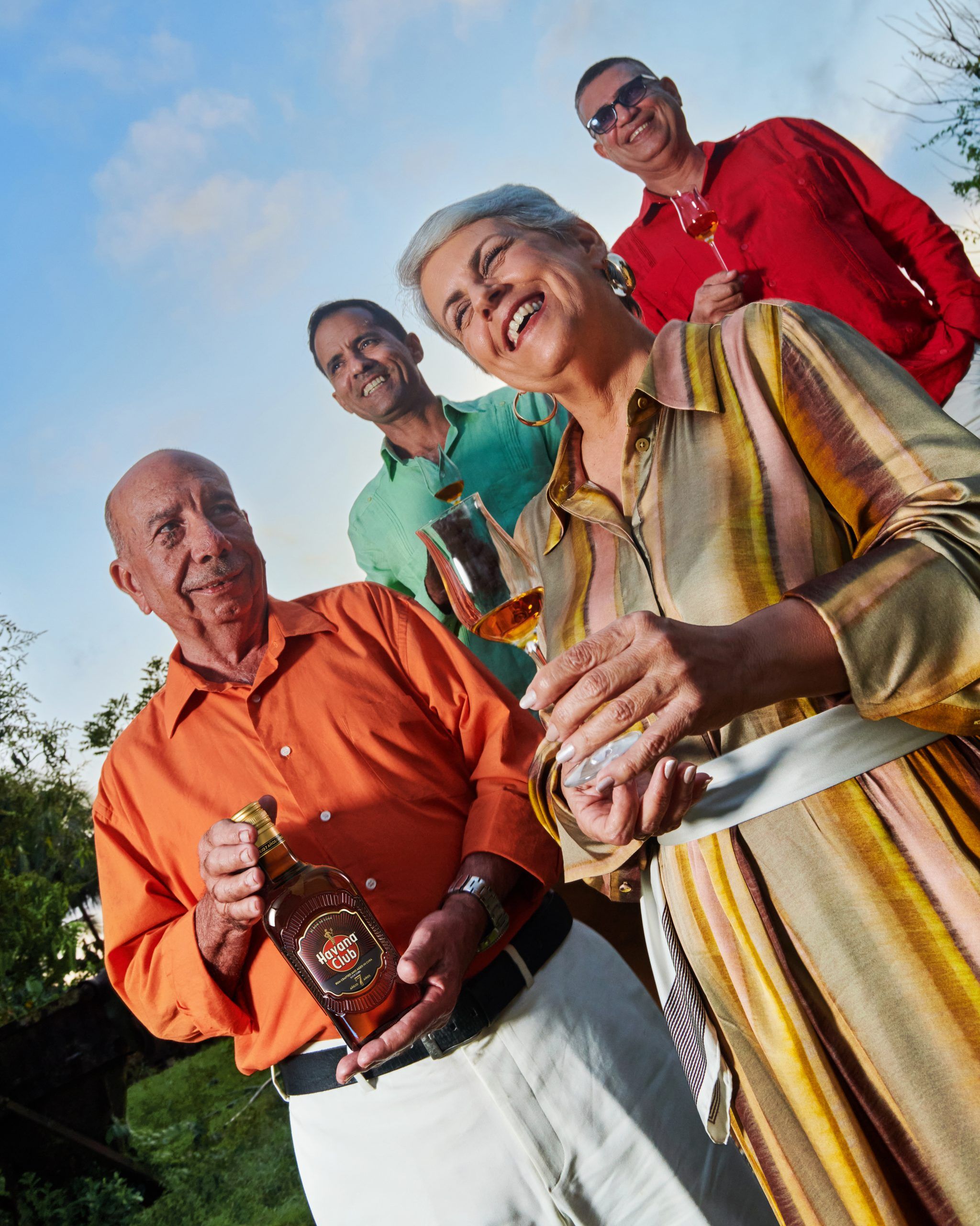 old people smiling showing new havana club 7 bottle