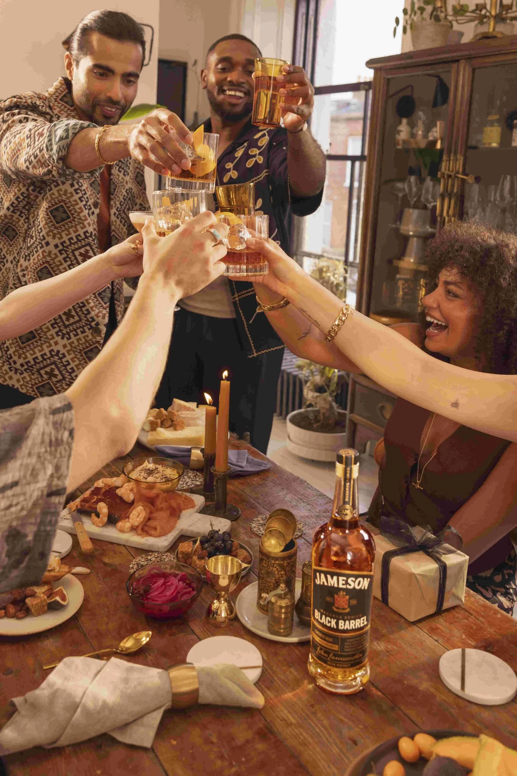 Friends celebrating with Jameson Black Barrel