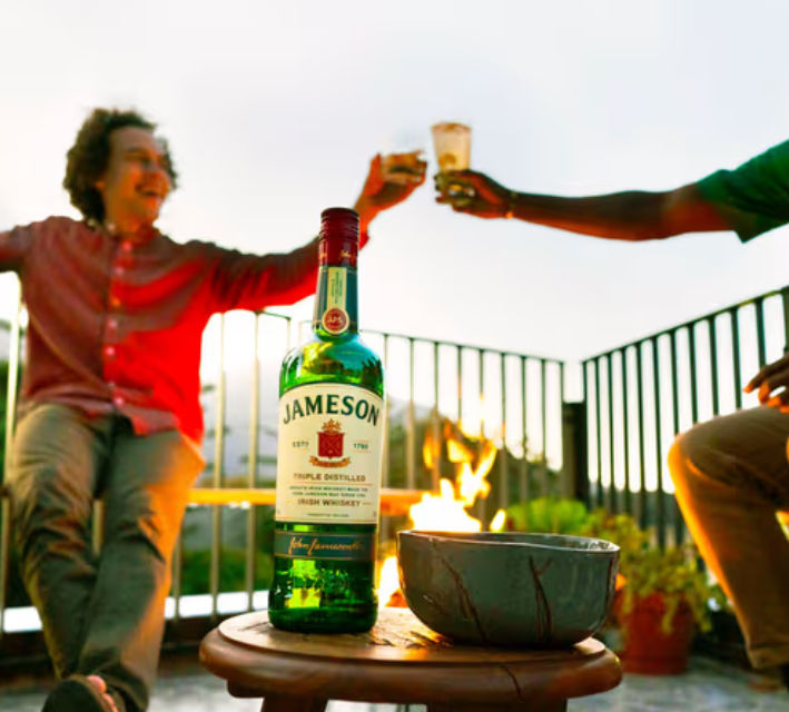 Friends drinking and Jameson Bottle