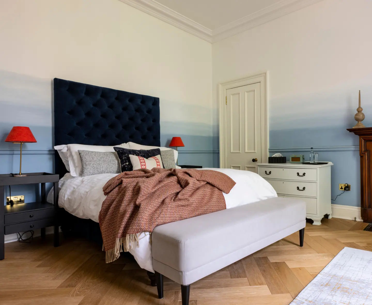The bright and airy Scapa bedroom with elegant furnishings and natural wood.