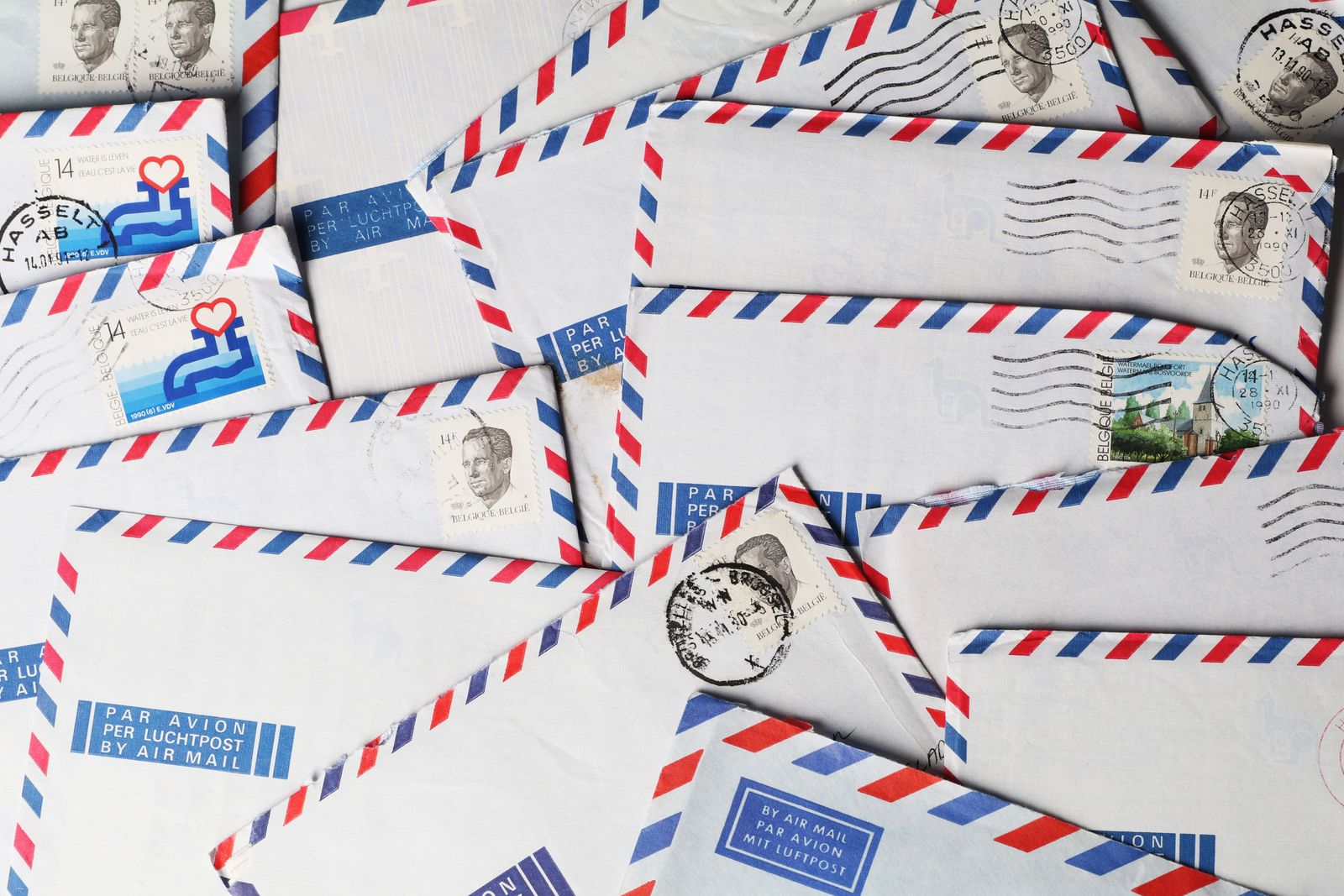 Stamped and postmarked envelopes spread out ready for mailing